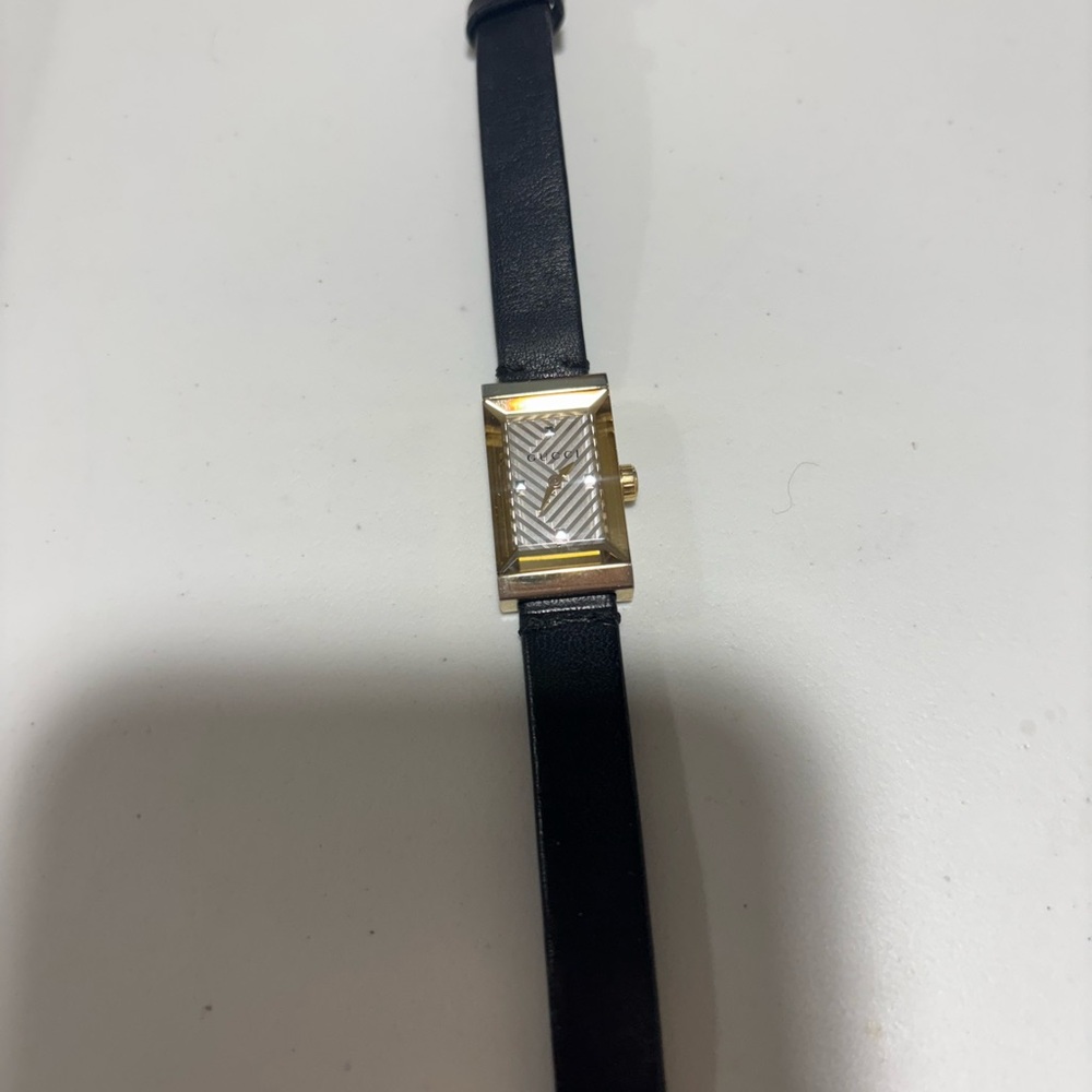 Gucci Gold and Black Watch with Sophisticated Design